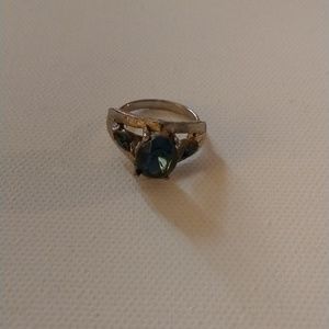 A ring with a blue green stone